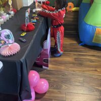 Hot wheels toy cars and decorated dessert table at Do it a-Ginn Event Hall birthday party.