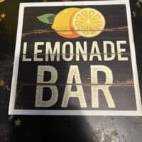 Lemonade bar sign at Do it a-Ginn Event Hall, highlighting fresh lemonade drinks for events and gatherings.