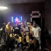 Vibrant group celebrating at Do it a-Ginn Event Hall with lively atmosphere, modern decor, and warm ambiance for unforgettable gatherings and events.