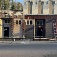 Modern event hall under renovation at Do it a-Ginn Event Hall, showcasing construction scaffolding and exterior updates. Perfect venue for weddings, parties, and corporate events in a stylish setting.