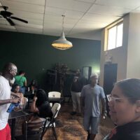 Family-friendly event space at Do it a-Ginn Event Hall, featuring a cozy interior with people socializing, perfect for private parties, gatherings, and celebrations in a welcoming atmosphere.