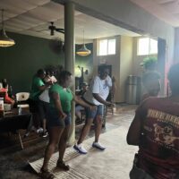 Vibrant indoor event at Do it a-Ginn Event Hall with guests dancing and socializing, showcasing a lively atmosphere perfect for celebrations and gatherings.